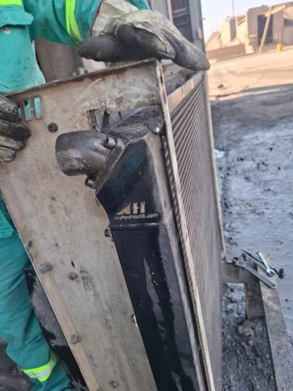 Hydraulic oil cooler removed on site for service