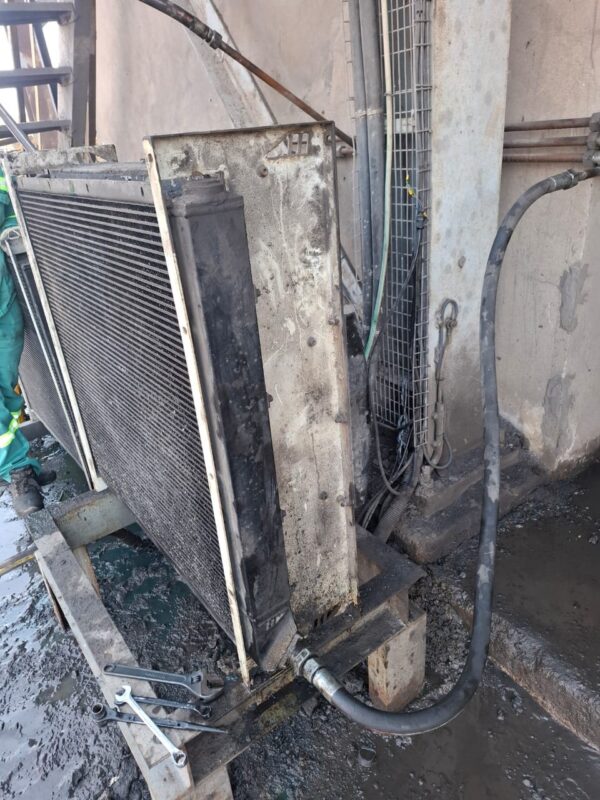 Hydraulic oil cooler being serviced at a plant
