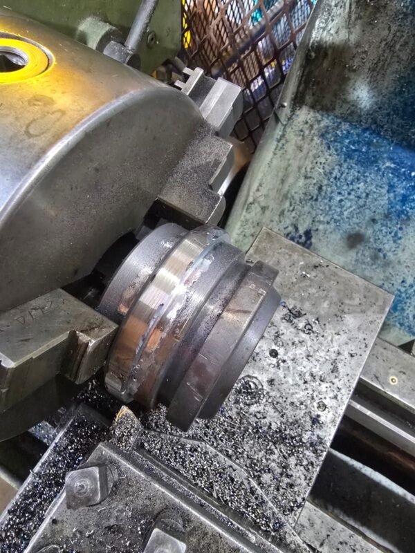 Hydraulic piston being machined on the lathe in the Hydraulic Squad workshop