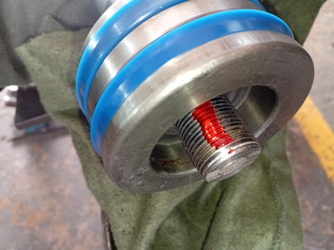 Hydraulic piston with new seals and thread locker