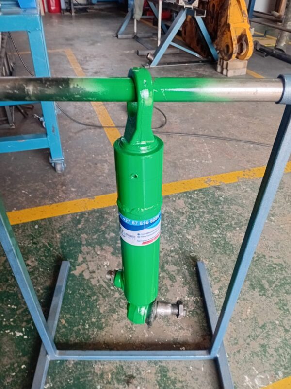 Refurbished hydraulic cylinder painted and labelled